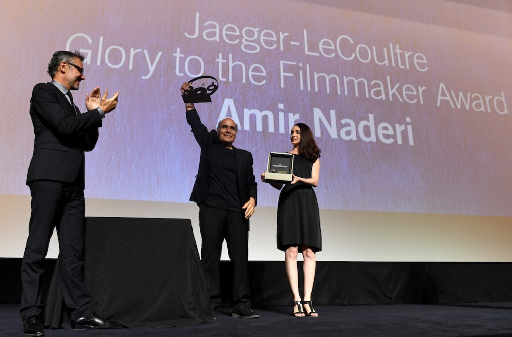 VENICE, ITALY - SEPTEMBER 05: Jaeger LeCoultre Communications Director Laurent Vinay (L) presents director Amir Naderi the Jaeger Le Coultre Glory To The Filmmaker Award on stage at the 'Jaeger-LeCoultre Glory To The Filmmaker 2016 Award' Honors Amir Naderi Award Ceremony during the 73rd Venice Film Festival at Hotel Excelsior on September 5, 2016 in Venice, Italy. (Photo by Ian Gavan/Getty Images for Jaeger-LeCoultre) *** Local Caption *** Amir Naderi; Laurent Vinay